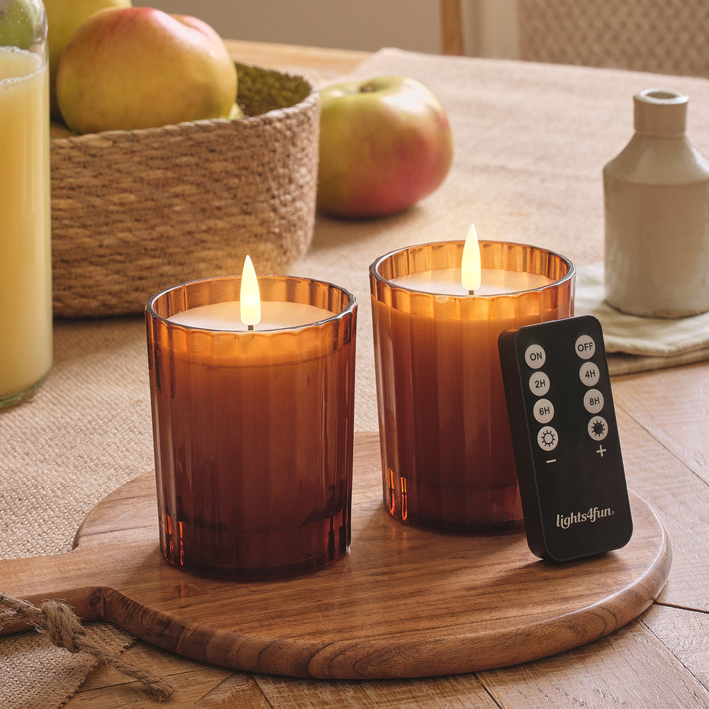 2er Set TruGlow® LED-Kerzen im geriffelten Glas in Orange mit Fernbedienung