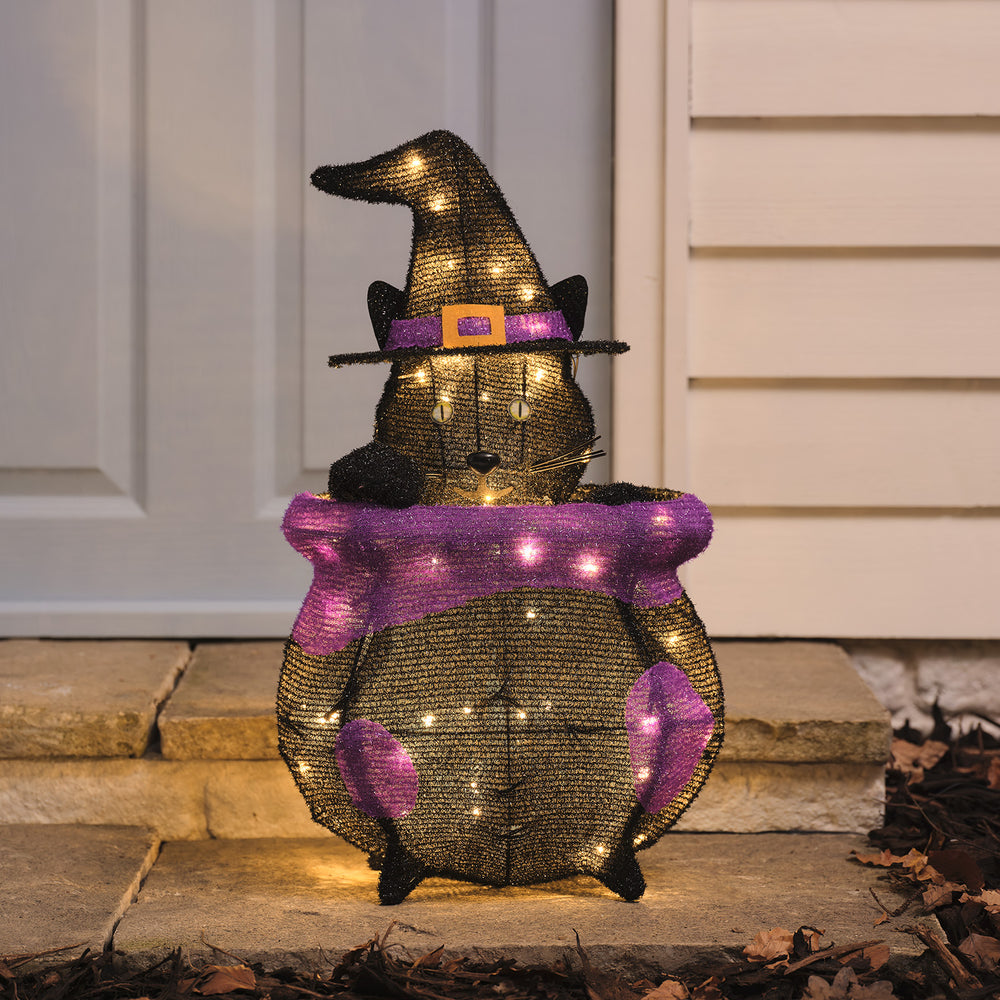"Katze im Kessel" LED-Halloween-Figur für den Außenbereich herausschauend